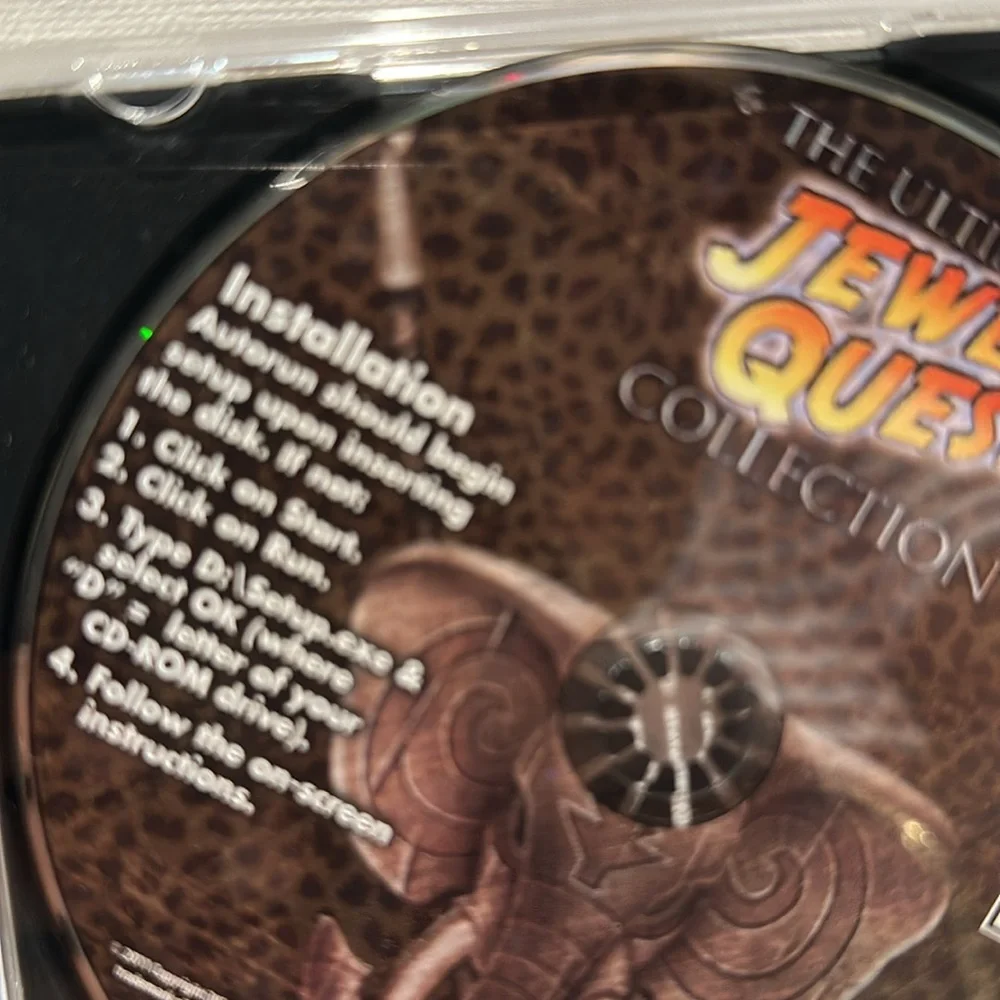 Used iWin The Ultimate Jewel Quest Collection CD-ROM Game. Rated E